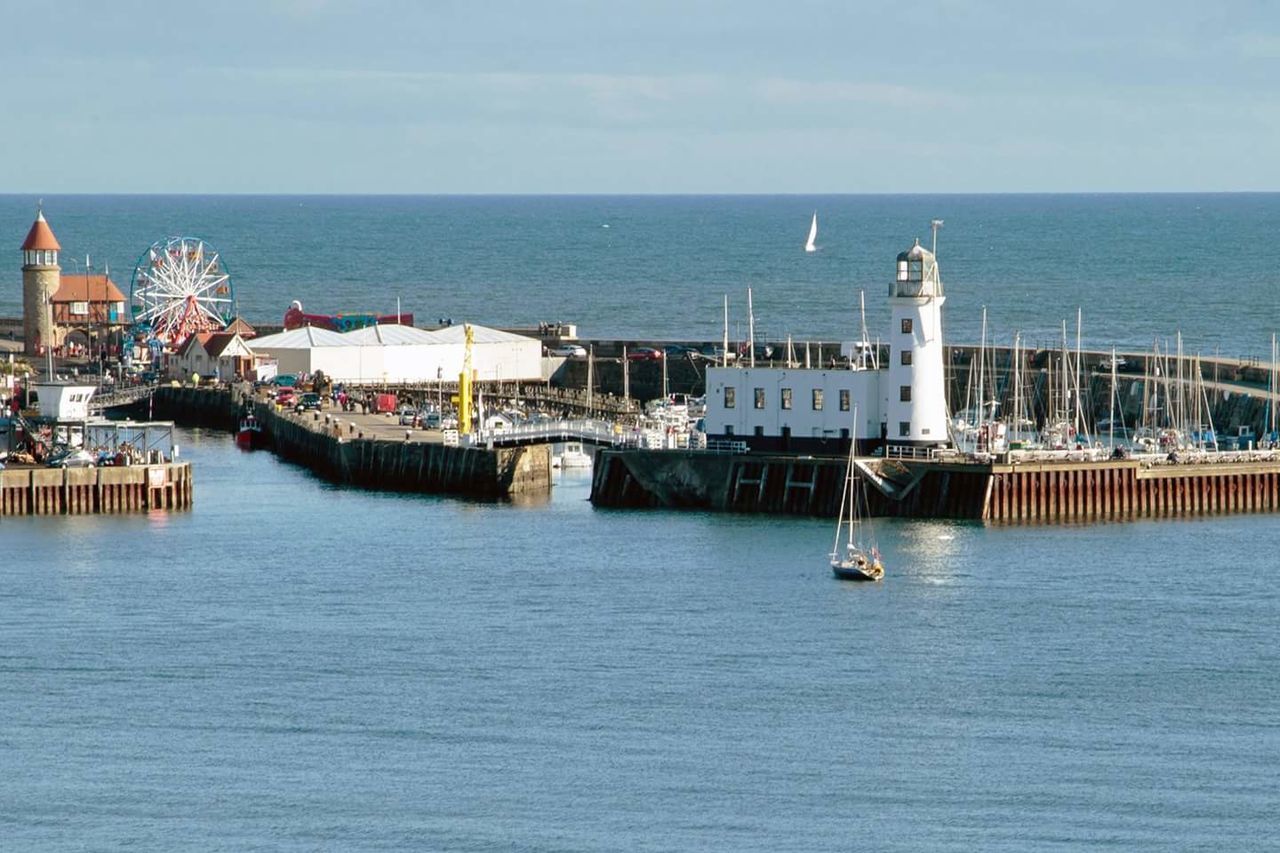 HIGH ANGLE VIEW OF SEA BY SHIP AGAINST SKY