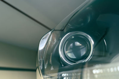 Detail of modern car projector headlight, shallow depth of field, filter effect