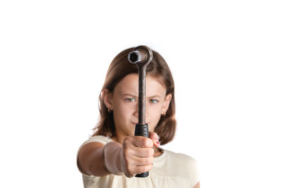 Portrait of beautiful young woman standing against white background