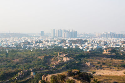 Aerial view of cityscape against clear sky