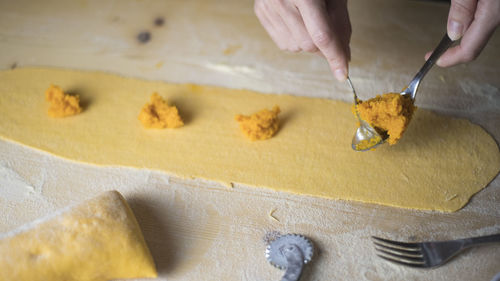 High angle view of man preparing food on table