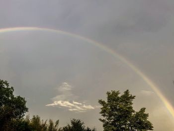 Low angle view of rainbow against sky