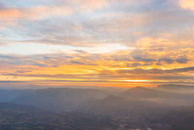 Scenic view of landscape against sky during sunset