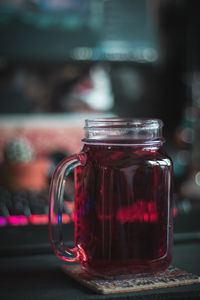 Close-up of glass jar on table