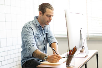 Young man working in office