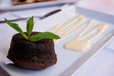 Close-up of brown muffin served in plate on table