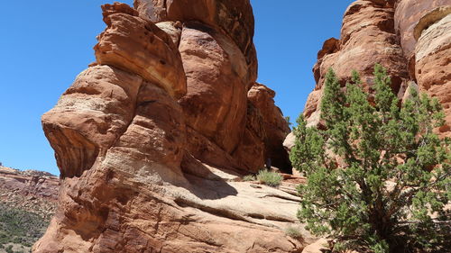 Low angle view of rock formation against sky