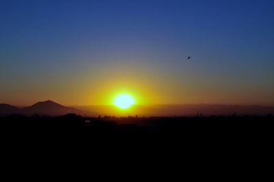 Scenic view of silhouette landscape against sky during sunset