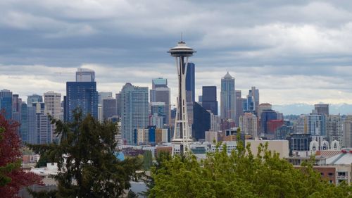 Skyscrapers in city against cloudy sky seen from kerry park