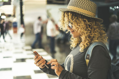 Rear view of woman using mobile phone