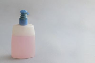 Close-up of bottle against white background