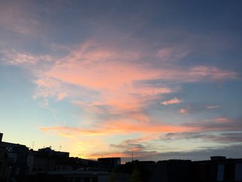 Low angle view of building against sky at sunset