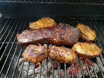 Close-up of meat on barbecue grill