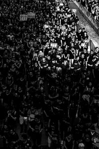 High angle view of people protesting on city street