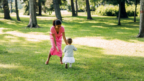 Full length of women walking on grass