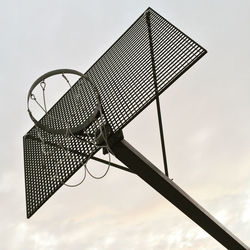 Low angle view of basketball hoop against clear sky