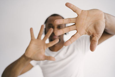 Close-up of person hand over white background