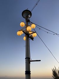 Low angle view of street light against clear sky