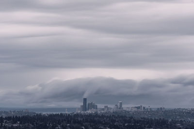 Buildings in city against sky