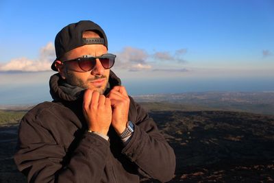 Man wearing sunglasses against sky