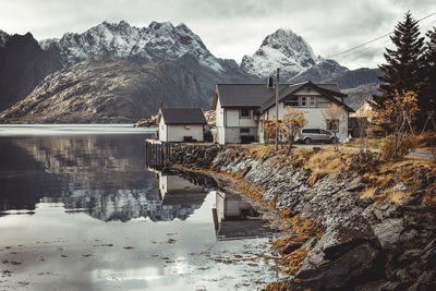 Typical scandinavian house by the lake in autumn