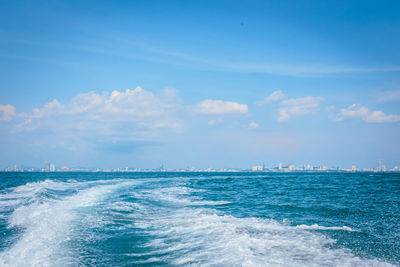 Scenic view of sea against blue sky