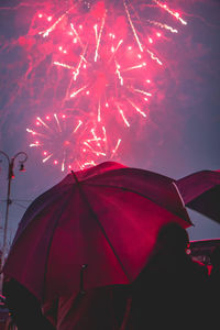 Low angle view of umbrella against sky during rainy season