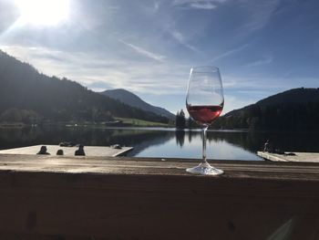 Boat on table by mountains against sky