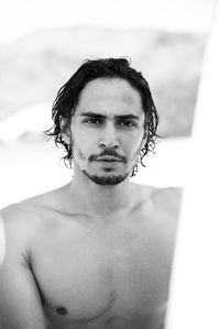 Portrait of handsome young man in swimming pool