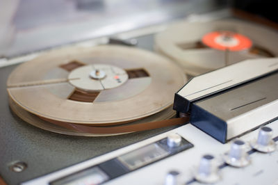 Close-up of vintage tape recorder with magnetic reels