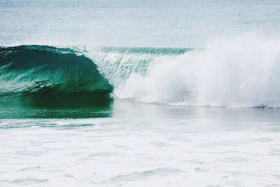 Waves in sea against sky