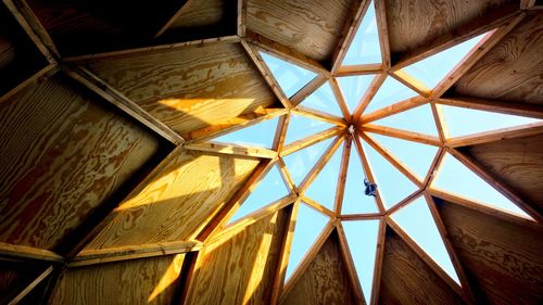 Insigt view from a wooden sauna into its dome and window