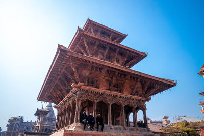 Low angle view of historical building against clear blue sky