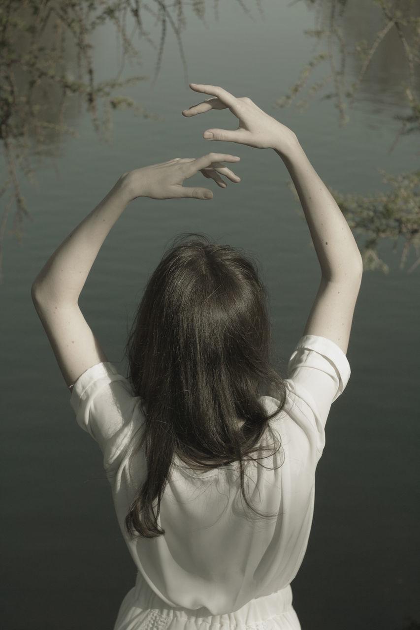 real people, rear view, one person, standing, day, outdoors, water, human hand, close-up