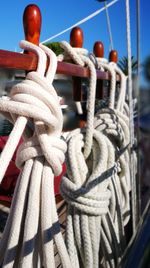 Close-up of rope tied on wooden post