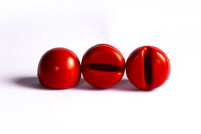 Close-up of tomatoes against white background