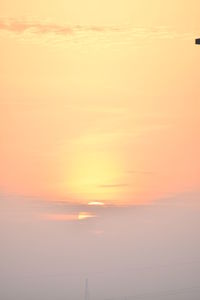 Scenic view of sea against romantic sky at sunset