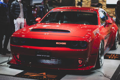 Rear view of red toy car on road