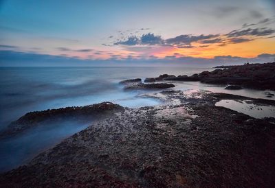 Scenic view of sea against sky during sunset