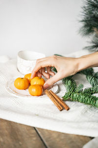 Midsection of woman preparing food on table