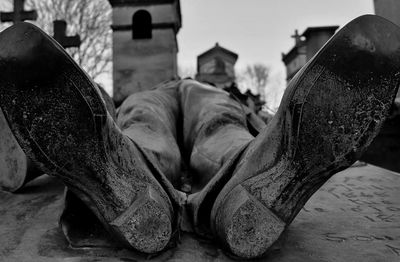 Low section of man lying outdoors