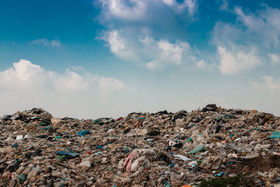 Low angle view of garbage against sky