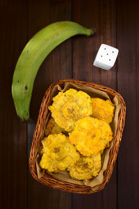 High angle view of fruits in basket on table