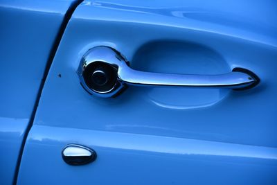 Close-up of blue vintage car handle