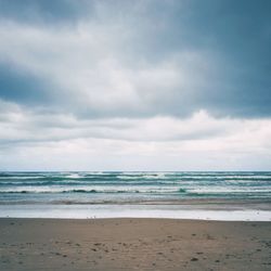 Scenic view of beach against sky