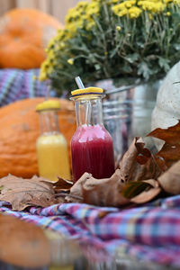 Close-up of drink in glass jar on table