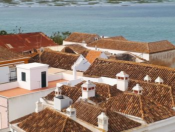 High angle view of houses by sea