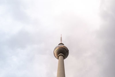 Low angle view of communications tower against sky