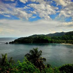 Scenic view of sea against cloudy sky