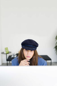 Woman sitting by the desktop at the office